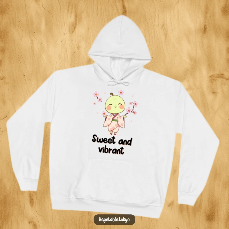 Funny hoodie featuring a delighted pea pod in a kimono, juggling cherry blossoms, offering cozy comfort and artistic humor.