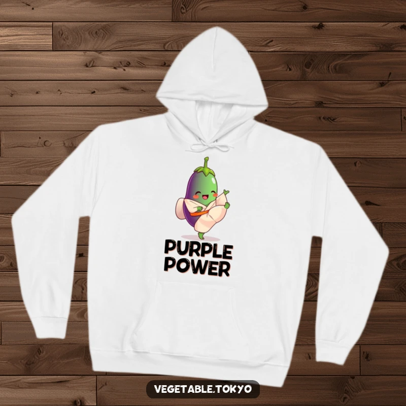 Funny hoodie featuring a giggling eggplant in a flowing kimono, kicking its leg high, offering cozy comfort and athletic humor.