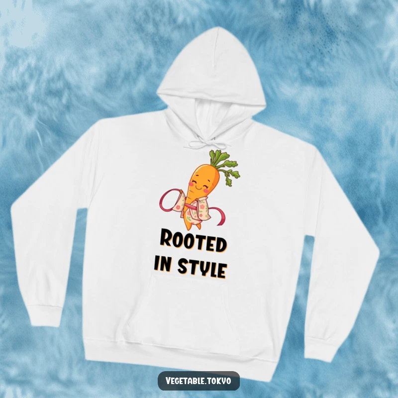 Funny hoodie with a smiling carrot in a floral kimono, twirling a ribbon, offering comfort and a touch of artistic humor.