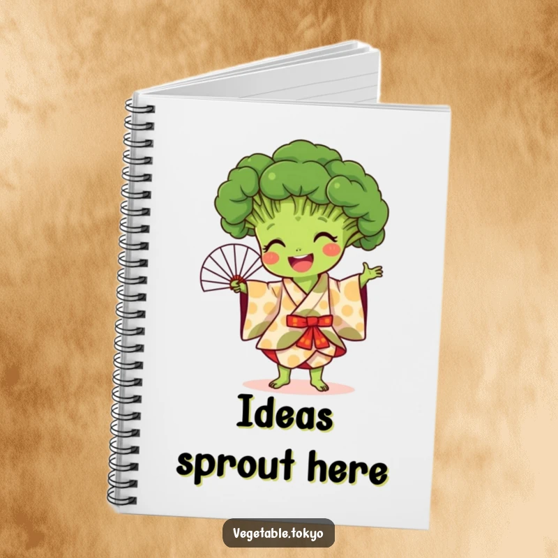 Funny notebook with a joyful broccoli in a patterned kimono, performing a fan dance, designed for capturing colorful ideas.